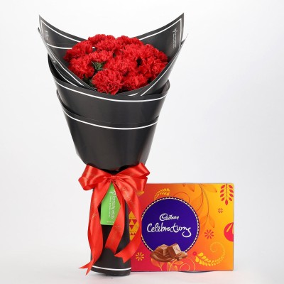 

Ferns N Petals Beautiful 12 Red Carnations & Celebrations Box Combo(550gms)