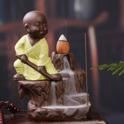 

AapnoCrafts Kung-Fu Style Monk Buddha Smoke Back flow Cone Incense Holder- With 10 Free Incence Cones Decorative Showpiece - 12 cm(Ceramic, Multicolor)