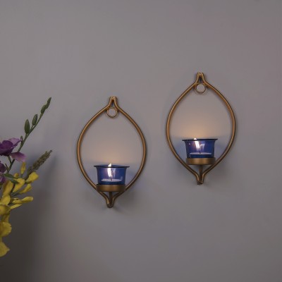 Flipkart SmartBuy Set of 2 Decorative Golden Eye Wall Sconce/Candle Holder with Blue Glass and Free T-Light Candles Iron, Glass Tealight Holder Set(Gold, Blue, Pack of 2)