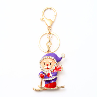 

Lotus E GOLDEN & CRYSTALS METALLIC PURPLE SANTA CLAUS WITH SLEIGH Key Chain