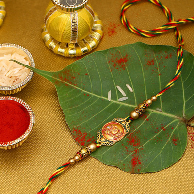 Voylla Religious Classic Divine Rakhi with Roli Chaawal Pack Mauli Thread Chawal Roli Pack  Set(Pack Of 1)