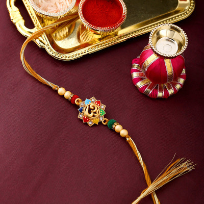 Voylla Religious Rudraksha OM Enameled Rakhi with Roli Chaawal Pack Mauli Thread Chawal Roli Pack  Set(Pack Of 1)