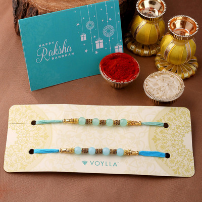 Voylla Religious Dazzling Rakhi Set of Two with Roli Chaawal Pack Mauli Thread Chawal Roli Pack  Set(Pack Of 2)