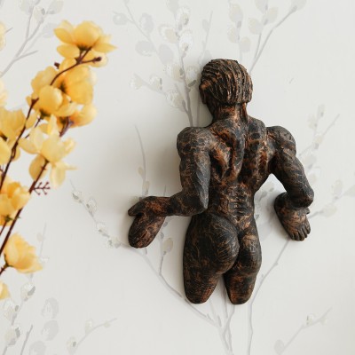 eCraftIndia Man Pushing Wall Antique Finish Handcrafted Polyresin Wall Decorative Decorative Showpiece  -  24 cm(Polyresin, Brown)