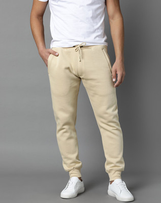 Rare Rabbit Solid Men Yellow Track Pants