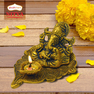 Shubhkart Nitya Ganesha on Paan Leaf With Diya- 138 g Decorative Showpiece  -  7.6 cm(Metal, Yellow)