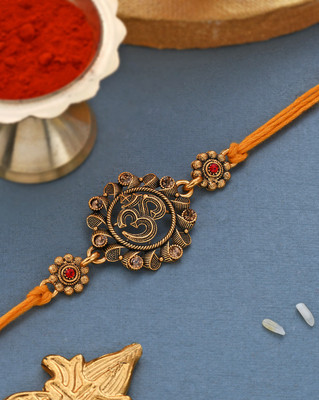 Voylla Designer Deity Inspired 'OM' Rakhi with Red Dori Mauli Thread Chawal Roli Pack  Set(1 rakhi)