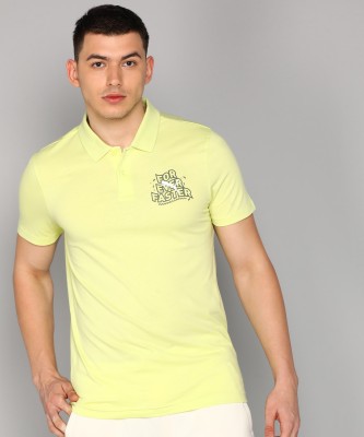 PUMA Solid Men Polo Neck Yellow T-Shirt