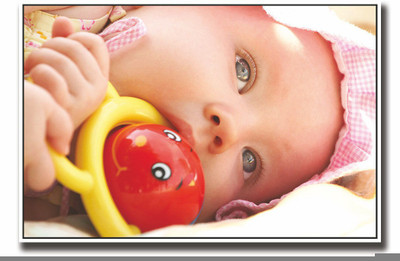 

Posterhouzz Baby playing with a toy Fine Art Print(12 inch X 18 inch, Rolled)