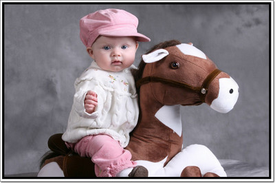 

Posterhouzz Baby Boy On Toy Poster Paper Print(12 inch X 18 inch, Rolled)