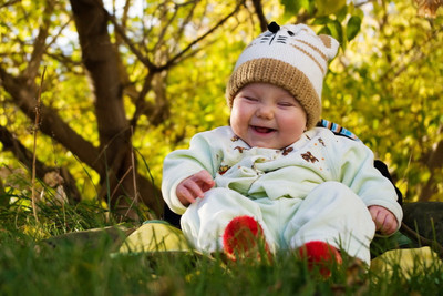 

Child's Love - Smiling Baby in the Garden Paper Print(12 inch X 18 inch, Stretched)