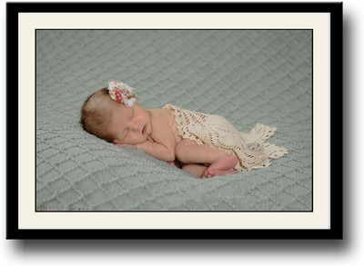 

Baby sleeping with a flower on head Fine Art Print(10 inch X 14 inch, Framed)