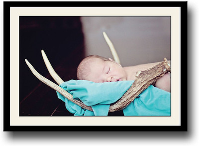 

Baby sleeping in wooden horns Fine Art Print(10 inch X 14 inch, Framed)