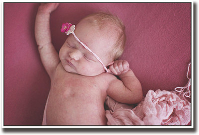 

Baby sleeping on a pink carpet Fine Art Print(12 inch X 18 inch, Rolled)