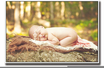 

Posterhouzz Cute baby sleeping on rock Fine Art Print(12 inch X 18 inch, Rolled)