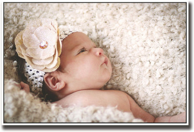 

Baby with brown flower in head Fine Art Print(12 inch X 18 inch, Rolled)