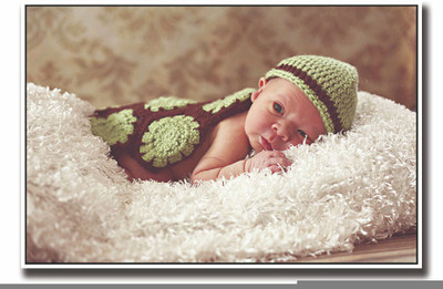 

Posterhouzz Baby in green image Fine Art Print(12 inch X 18 inch, Rolled)