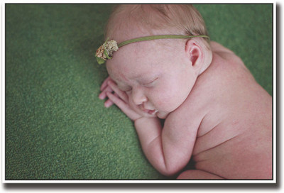 

Baby sleeping on green carpet Fine Art Print(12 inch X 18 inch, Rolled)