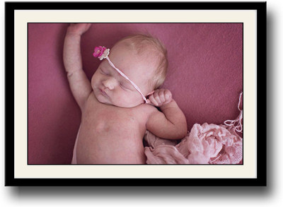 

Baby sleeping on a pink carpet Fine Art Print(10 inch X 14 inch, Framed)