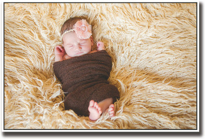 

Baby wrapped in brown looking cute Fine Art Print(12 inch X 18 inch, Rolled)