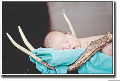 

Posterhouzz Baby sleeping in wooden horns Fine Art Print(12 inch X 18 inch, Rolled)