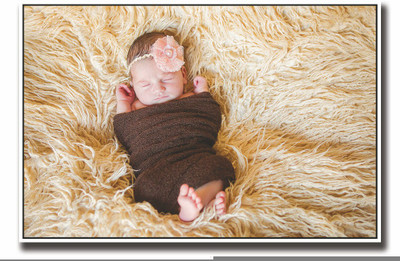 

Posterhouzz Baby wrapped in brown looking cute Fine Art Print(12 inch X 18 inch, Rolled)