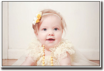 

Cute baby girl with yellow necklace Fine Art Print(12 inch X 18 inch, Rolled)