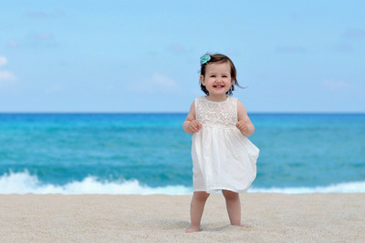 

Child's Love - Smiling Girl on the Sea Shore Paper Print(12 inch X 18 inch, Stretched)