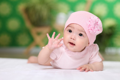 Baby in pink dress shop