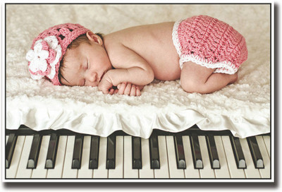 

Baby sleeping on piano Fine Art Print(12 inch X 18 inch, Rolled)