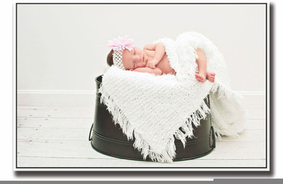 

Posterhouzz Baby sleeping on black bucket Fine Art Print(12 inch X 18 inch, Rolled)