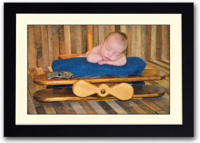 

Baby On A Wooden Plane Fine Art Print(14 inch X 20 inch, Framed)