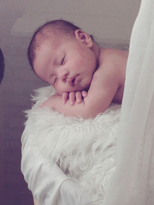 

Posterhouzz Cute Baby On Feather Bed Photographic Paper(18 inch X 12 inch, Rolled)