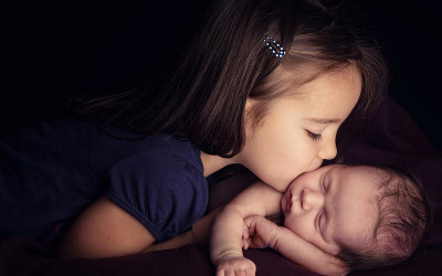 

Posterhouzz Little Girl Kissing NewBorn Photographic Paper(12 inch X 18 inch, Rolled)