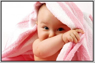 Posterhouzz Smiling Baby in Pink Towel Poster Paper Print(12 inch X 18 inch, Rolled)