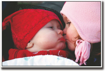 

Girl kissing a newborn baby Fine Art Print(12 inch X 18 inch, Rolled)