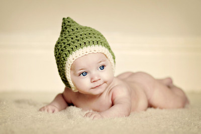 

Child's Love - Cute Baby In a Green Hat Paper Print(12 inch X 18 inch, Streched)