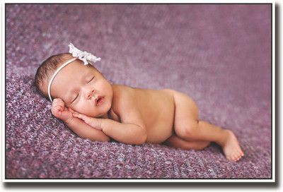 

Cutely sleeping baby on purple Fine Art Print(12 inch X 18 inch, Rolled)