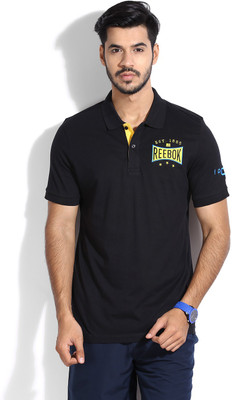 

REEBOK Solid Men's Polo Neck Black, Yellow T-Shirt