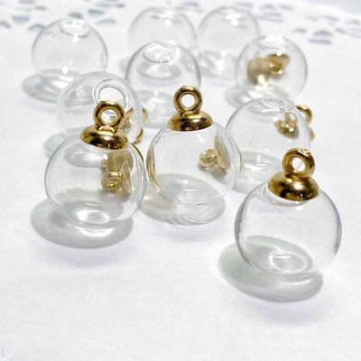 Sell plus Mini Glass Round Transeparent Bottle With Golden Cap