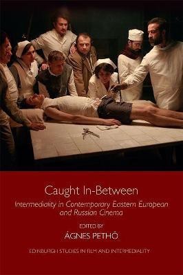 Caught in-Between(English, Hardcover, unknown)