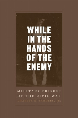 While in the Hands of the Enemy(English, Paperback, Jr Charles W. Sanders)