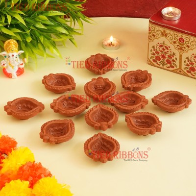 TIED RIBBONS Set of 12 Handmade Terracotta Oil Lamp Mitti Clay Diyas for Home Decor Office Pooja Room Temple Indoor Outdoor Diwali Lighting Decoration Gift Items Terracotta (Pack of 12) Table Diya Set(Height: 1 inch)