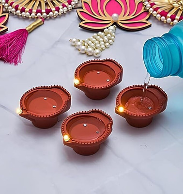 JAISH ADVERTISING Flameless and Water Sensor LED Brown Diyas Candle Eco-Friendly Diya Plastic (Pack of 12) Table Diya(Height: 1.3 inch)