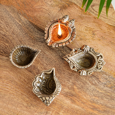 ExclusiveLane 'Laxmi-Ganesh, Shankh Pushp' Handcarved Hand-Etched 15 & 10 ml Brass (Pack of 4) Table Diya Set(Height: 1.5 inch)