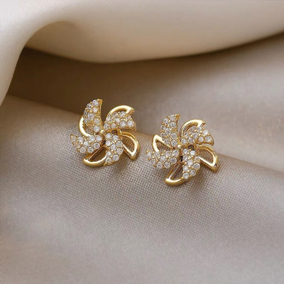 Vembley Beautiful Korean Studded Windmill Rotating Stud Earrings For Girls & Women Cubic Zirconia Alloy Stud Earring