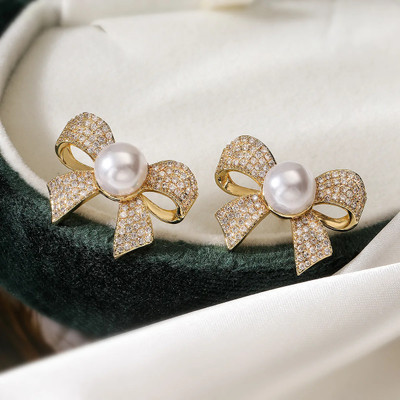 Celestria Bow Shaped Pearl Zircon Stud Earrings for women Pearl Alloy Stud Earring
