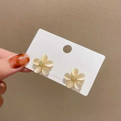 DiegoEnterprise Glossy Golden Flower Shaped Earrings for women and girls Metal Stud Earring