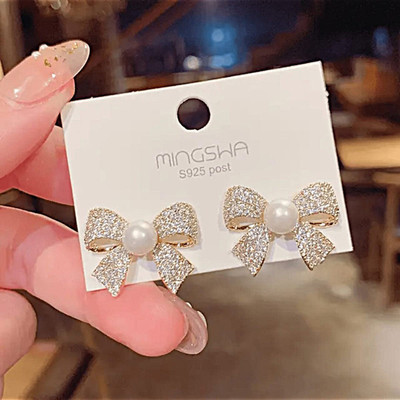 glamourgeekstudio Golden Bow With White Pearl Charm Stud Earrings Cubic Zirconia Alloy Stud Earring