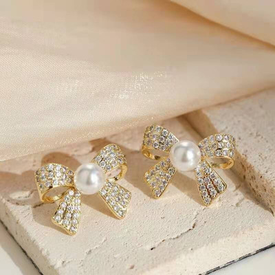 Divastri Diamond Bow Earrings for women korean earing girl Moti Ear Ring stylish Western Pearl, Cubic Zirconia, Diamond Gold, Alloy, Mother of Pearl, Stone Earring Set, Stud Earring